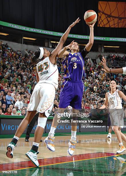 Candace Parker of the Los Angeles Sparks shoots against Ashley Robinson of the Seattle Storm on May 16, 2010 at Key Arena in Seattle, Washington....