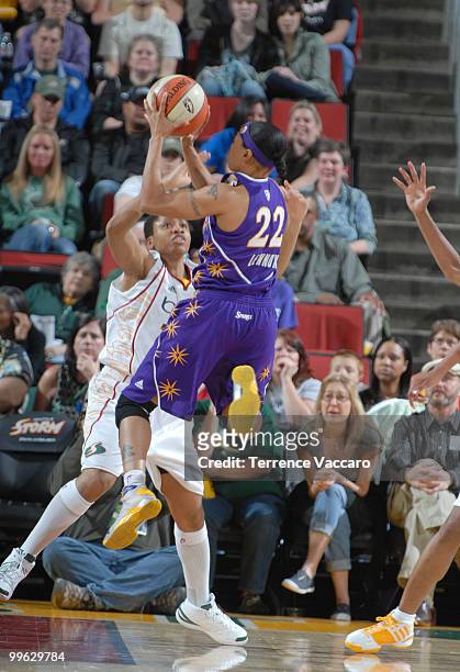 Betty Lennox of the Los Angeles Sparks shoots against Tanisha Wright of the Seattle Storm on May 16, 2010 at Key Arena in Seattle, Washington. NOTE...