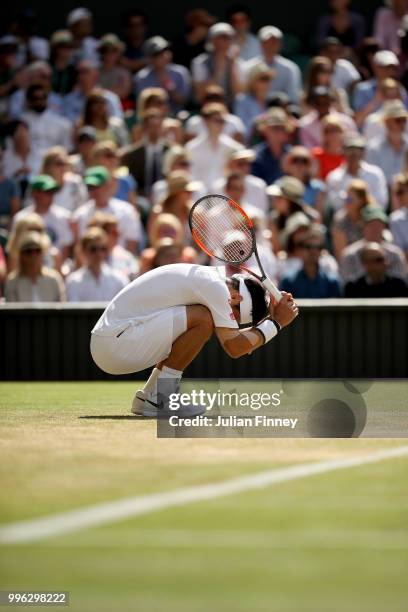 Kei Nishikori of Japan reacts against Novak Djokovic of Serbia during their Men's Singles Quarter-Finals match on day nine of the Wimbledon Lawn...