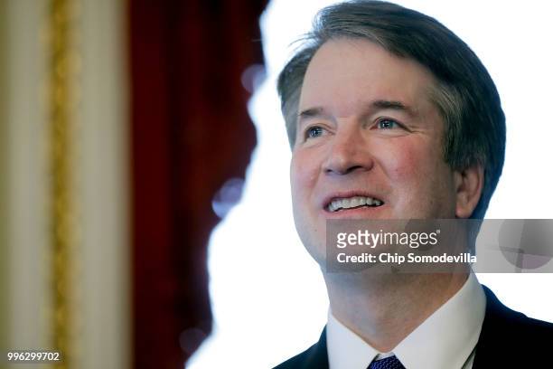 Judge Brett Kavanaugh poses for journalists before a meeting with Senate Finance Committee Chairman Orrin Hatch in the Senate President pro tempore...