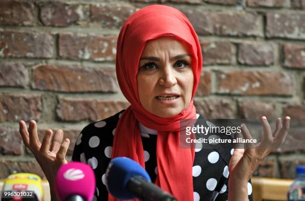 July 2018, Germany, Cologne: Meral Sahin, spokesperson of the IG Keuptstrasse , delivers a speech during a press conference of the initiative...