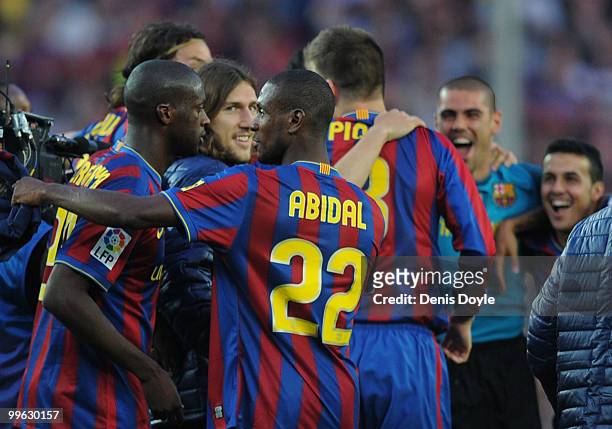 Eric Abidal celebrates after Barcelona beat Real Valladolid 4-0 to clinch La Liga title after their match at Camp Nou stadium on May 16, 2010 in...