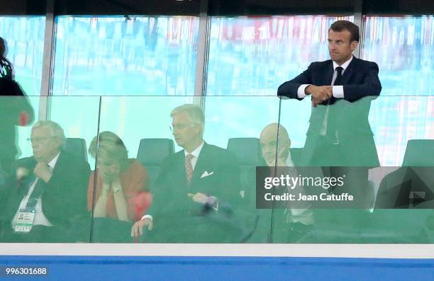 President of France Emmanuel Macron stands while King Philippe of Belgium, Queen Mathilde of Belgium, FIFA President Gianni Infantino look on during...