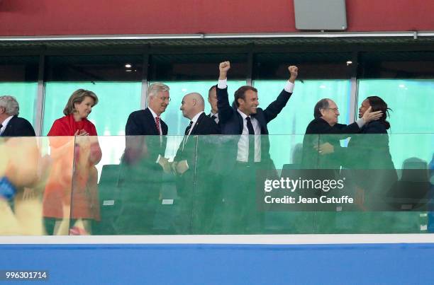 President of France Emmanuel Macron celebrates the victory with President of French Football Federation Noel Le Graet kissing French Minister of...