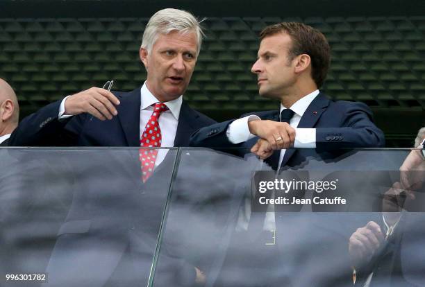 King Philippe of Belgium chats with President of France Emmanuel Macron during the 2018 FIFA World Cup Russia Semi Final match between France and...