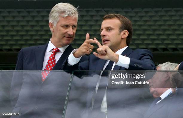 King Philippe of Belgium chats with President of France Emmanuel Macron during the 2018 FIFA World Cup Russia Semi Final match between France and...