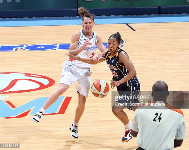 Briann January of the Indiana Fever battles for the ball against Kelly Miller of the Atlanta Dream at Philips Arena on May 16, 2010 in Atlanta,...