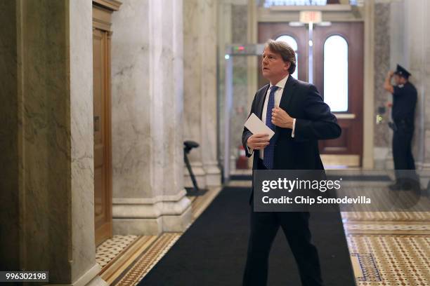 White House Counsel Don McGahn heads to a meeting between Senate Majority Whip John Cornyn and Judge Brett Kavanaugh at the U.S. Capitol July 11,...