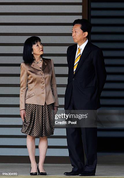 Miyuki Hatoyama looks at her husband Japanese Prime Minister Yukio Hatoyama as they wait for their car at the Imperial Palace on May 17, 2010 in...