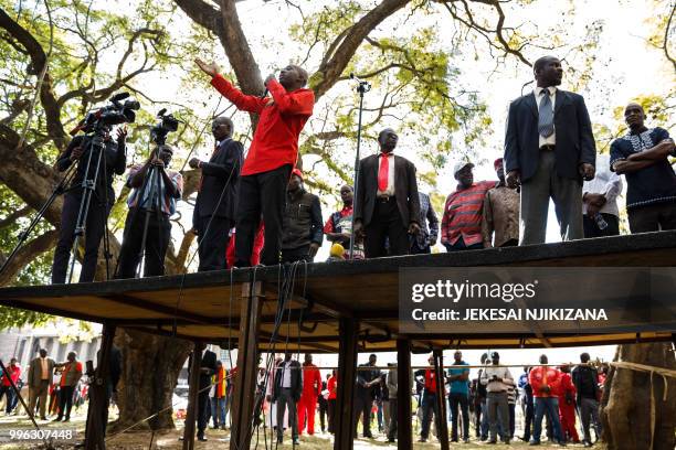 Opposition leader Nelson Chamisa addresses Zimbabwe main opposition party the Movement for Democratic Change Alliance supporters during a march for...