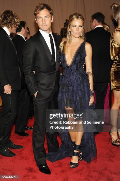 Jude Law and Sienna Miller attend the Costume Institute Gala Benefit to celebrate the opening of the "American Woman: Fashioning a National Identity"...