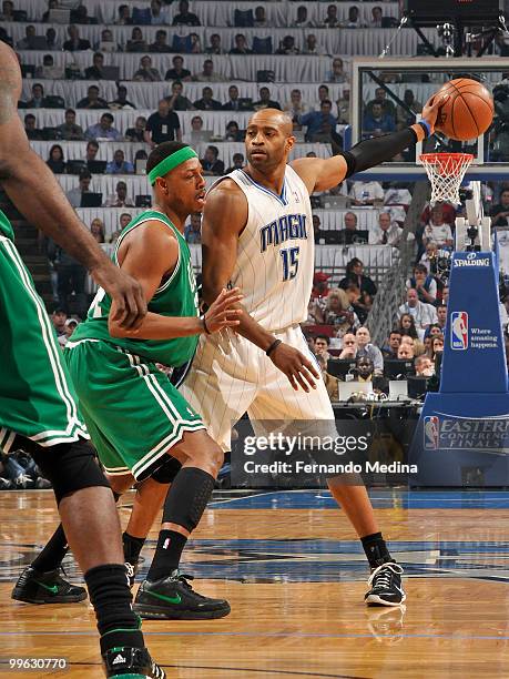 Vince Carter of the Orlando Magic holds the ball away from Paul Pierce of the Boston Celtics in Game One of the Eastern Conference Finals during the...