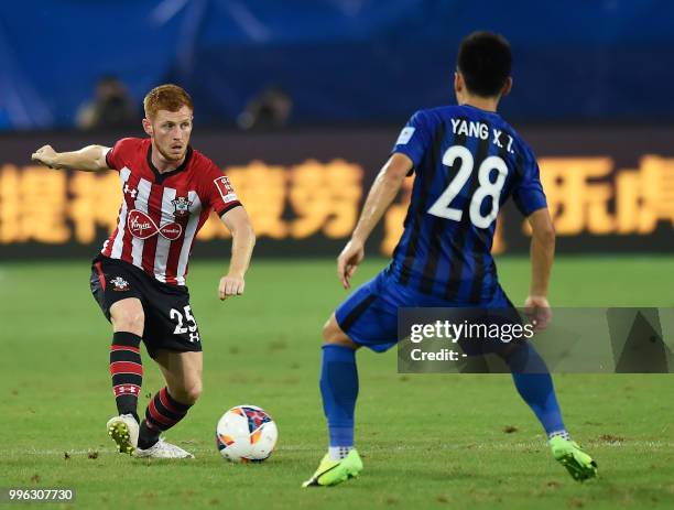 Southampton's Harrison Reed vies for the ball with Jiangsu Suning's Yang Xiaotian during the 2018 CSC International Football Club Super Cup football...