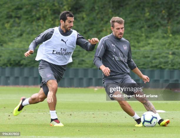 Henrikh Mkhitaryan and Aaron Ramsey of Arsenal during a training session at London Colney on July 11, 2018 in St Albans, England.