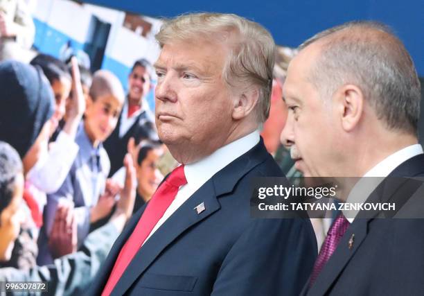 President Donald Trump talks with Turkey's President Recep Tayyip Erdogan at NATO headquarters in Brussels during the NATO summit on July 11, 2018.