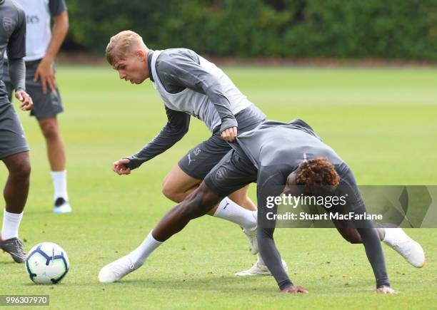 Emile Smith Rown and Jeff Reine-Adelaide of Arsenal during a training session at London Colney on July 11, 2018 in St Albans, England.