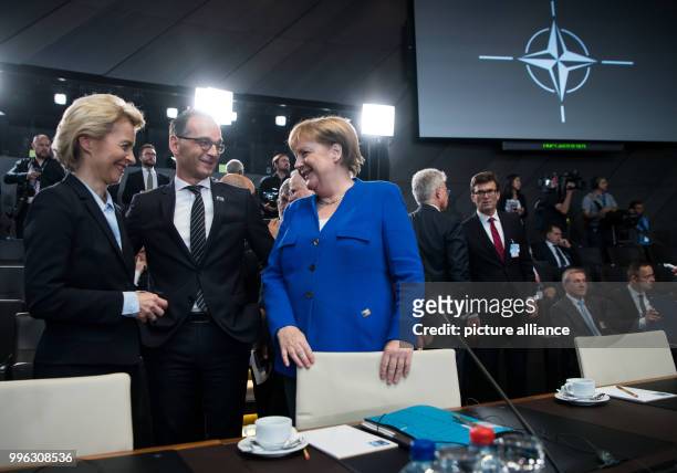 July 2018, Brussels, Belgium: German Chancellor Angela Merkel of the Christian Democratic Union , German Foreign Minister Heiko Maas of the Social...