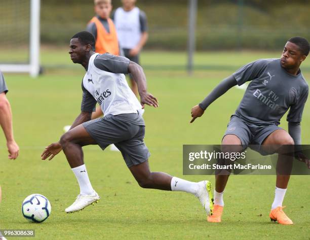 Jordi Osei-Tutu and Chuba Akpom of Arsenal during a training session at London Colney on July 11, 2018 in St Albans, England.