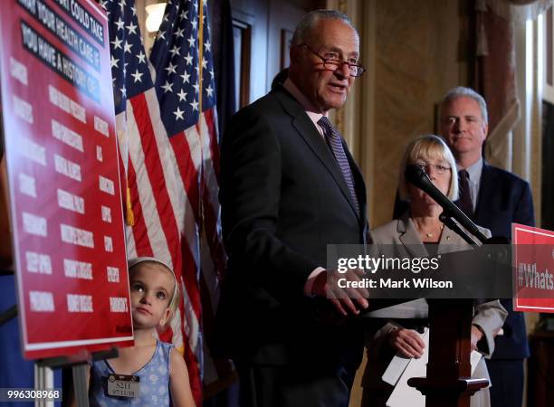 Senate Minority Leader Chuck Schumer speaks about healthcare while flanked by 6 yo Charlie Wood who has complex medical needs from being born 3...