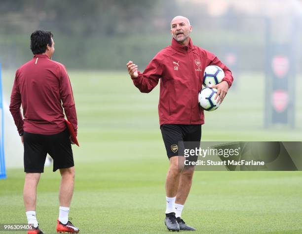 Arsenal Head Coach Unai Emery with assistant Stve Bould during a training session at London Colney on July 11, 2018 in St Albans, England.