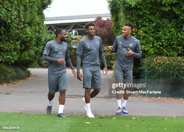 Alex Lacazette, Pierre-Emerick Aubameyang and Jeff Reine-Adelaide of Arsenal before a training session at London Colney on July 11, 2018 in St...