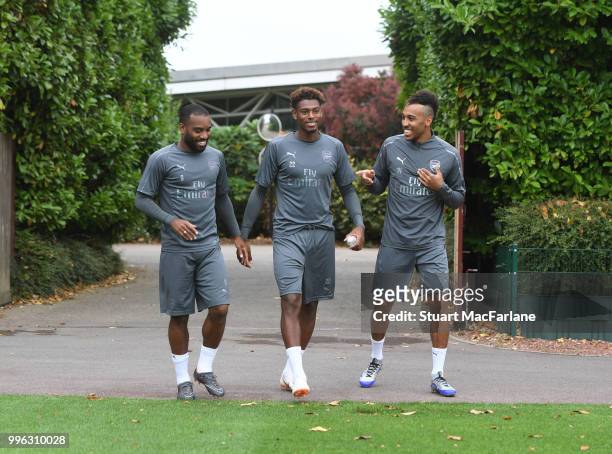 Alex Lacazette, Pierre-Emerick Aubameyang and Jeff Reine-Adelaide of Arsenal before a training session at London Colney on July 11, 2018 in St...