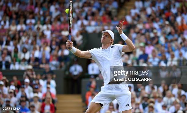 South Africa's Kevin Anderson returns against Switzerland's Roger Federer during their men's singles quarter-finals match on the ninth day of the...