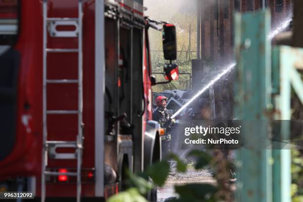 Firefighters in action are seen in Gdansk, Poland on 11 July 2018 Giant fire of the car repair garage, blowed-up on Thursday afternoon, just few...