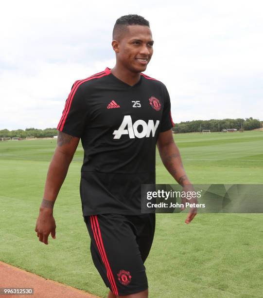 Antonio Valencia of Manchester United walks out ahead of a first team training session at Aon Training Complex on July 11, 2018 in Manchester,...
