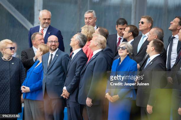 Heads of state and government, including Lithuanian President Dalia Grybauskaite, German Chancellor Angela Merkel, Belgian Prime Minister Charles...