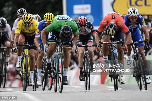 Slovakia's Peter Sagan sprints in the last meters to win ahead of Italy's Sonny Colbrelli and Belgium's Philippe Gilbert the fifth stage of the 105th...