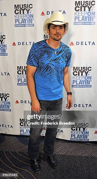 Country singer Brad Paisley poses after working the phone bank during the "Music City Keep on Playin'" benefit concert at the Nashville Convention...