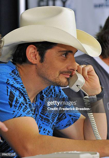 Country singer Brad Paisley works the phone bank during the "Music City Keep on Playin'" benefit concert at the Nashville Convention center on May...