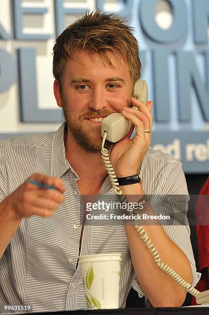 Country singer Charles Kelley, of the band Lady Antebellum, works the phone bank during the "Music City Keep on Playin'" benefit concert at the...