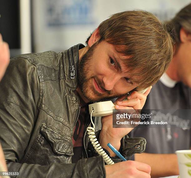 Country singer Dave Haywood, of the band Lady Antebellum, works the phone bank during the "Music City Keep on Playin'" benefit concert at the...