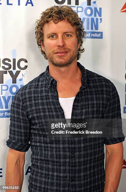 Country singer Dierks Bentley poses after working the phone bank during the "Music City Keep on Playin'" benefit concert at the Nashville Convention...