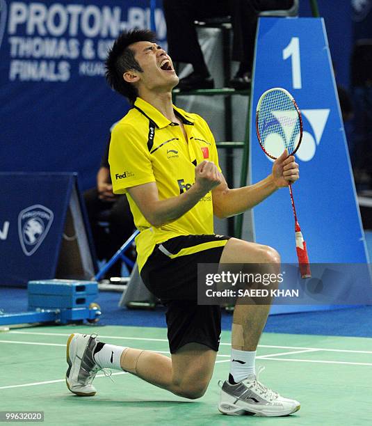 China's Lin Dan shouts in jubilation after defeating Indonesia's Taufik Hidayat in the Thomas Cup badminton championships in Kuala Lumpur on May 16,...