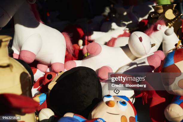 Game prizes sit at a booth at Luna Park in Coney Island in the Brooklyn Borough of New York, U.S., on Saturday, July 7, 2018. Bloomberg is scheduled...