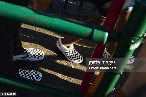 People wait to ride an amusement park ride at Luna Park in Coney Island in the Brooklyn Borough of New York, U.S., on Saturday, July 7, 2018....
