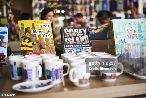 Souvenirs sit on display for sale at a store on the Coney Island boardwalk in the Brooklyn Borough of New York, U.S., on Saturday, July 7, 2018....