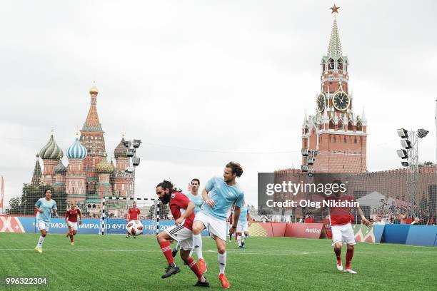 Juan Pablo Sorin and Diego Forlan compete during the Legends Football Match in "The park of Soccer and rest" at Red Square on July 11, 2018 in...