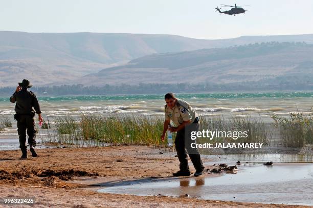Israeli forces search the Sea of Galilee coasts for the remains of a reported drone launched from Syria and intercepted by a Patriot missile on July...