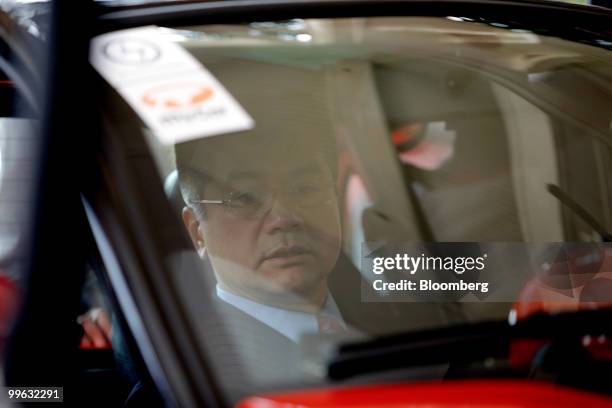 Commerce Secretary Gary Locke inspects a EuAuto Technology Ltd. MyCar electric vehicle in Hong Kong, China, on Monday, May 17, 2010. GreenTech...