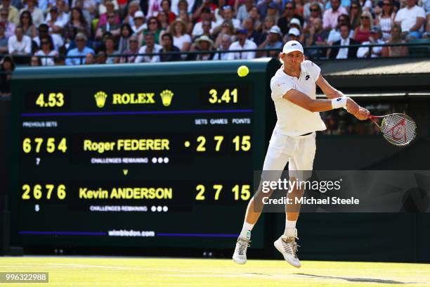 Kevin Anderson of South Africa plays a backhand against Roger Federer of Switzerland during their Men's Singles Quarter-Finals match on day nine of...