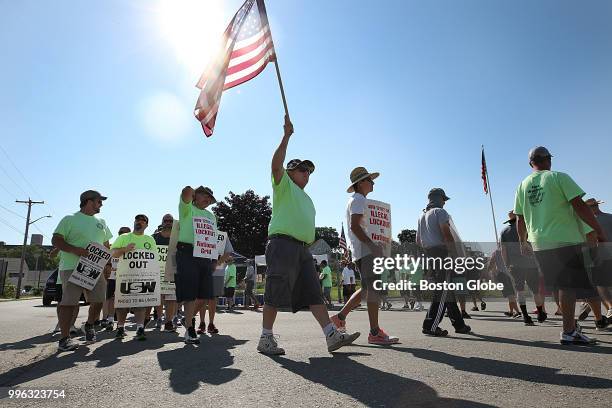 Locked-out National Grid workers protest outside the National Grid facility on Rock Street in Lowell, MA on July 10, 2018. As the lockout at National...
