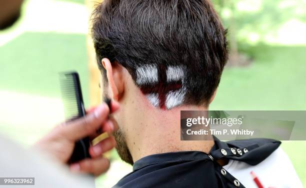 Justin Carr, England's World Cup barber, gets fans ready for tonight's match as they go Scalp Brave with Head & Shoulders at Flat Iron Square on July...