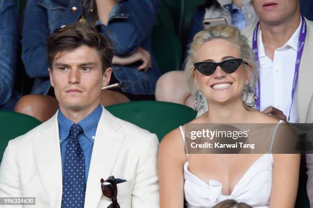 Oliver Cheshire and Pixie Lott attend day nine of the Wimbledon Tennis Championships at the All England Lawn Tennis and Croquet Club on July 11, 2018...