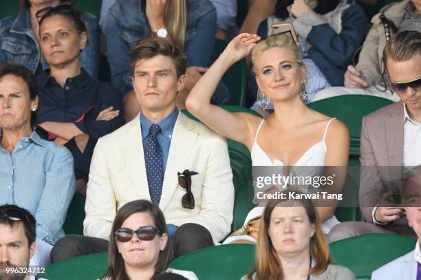 Oliver Cheshire and Pixie Lott attend day nine of the Wimbledon Tennis Championships at the All England Lawn Tennis and Croquet Club on July 11, 2018...