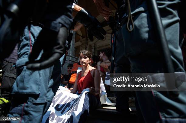 Italian Police remove the protesters wearing life jackets from the Ministry of Transport during a protest against the Italian immigration policy, on...