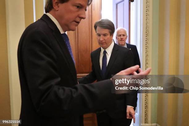 White House Counsel Don McGahn, Judge Brett Kavanaugh and Senate Majority Whip John Cornyn leave his office after a meeting at the U.S. Capitol July...